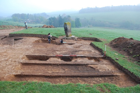 The Craw Stane with possible structures that may represent one or more buildings under excavation in the foreground (scale 2m)