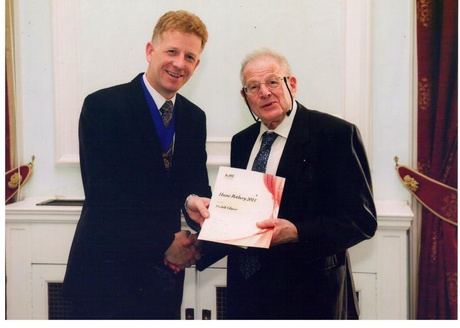 Professor Glasser (right) being presented with the Hume Rothery Award by JCH Lewis, President of the Institute of Minerals, Mining and Manufacturing.