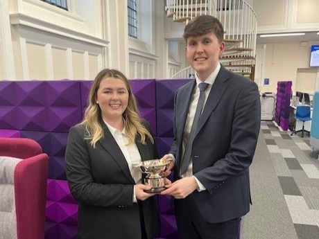 Callum and Ailsa at the University of Dundee holding a silver trophy