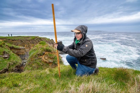 Dr Natalie Isaksson sets up a bird camera trap in Caithness. Copyright: University of the Highlands and Islands.