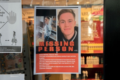 Missing person poster with a photograph