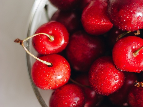 close up on a bowl of ripe red cherries