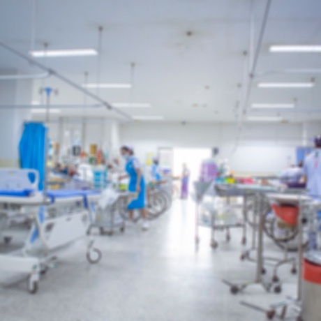 blurred image of full hospital ward