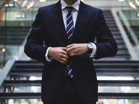 Businessman in a suit standing in an office building