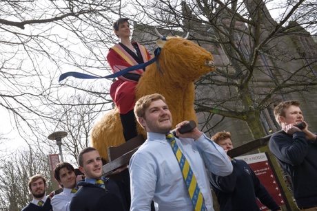 Maggie Chapman carried aloft by the University rugby team as part of her installation as Rector