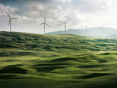 wind turbines on a grassy hillside