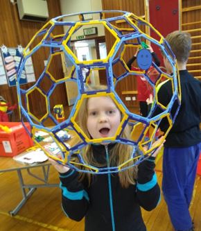 Image shows a child playing with a plastic Kinnect style ball
