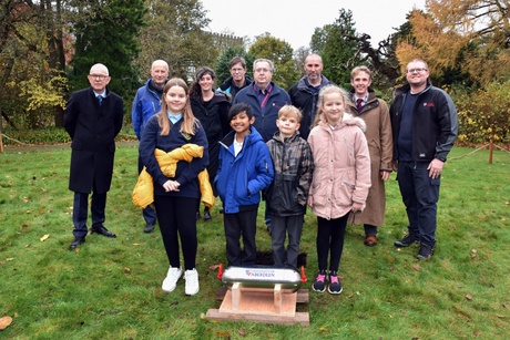 Professor George Boyne alongside University staff and pupils from St Peter's Primary School at the climate capsule burial even