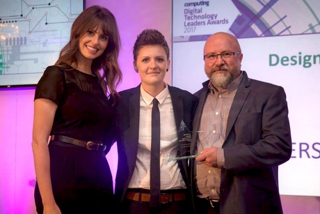 Host Ellie Taylor presents the Design Team of the Year award to Zee Allison and Colin Denholm<br />(Image: www.computing.co.uk)