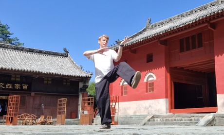 Man doing tai chi outside
