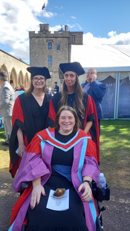 Prof Lesley Anderson (front) Dr Emma Tarburn (R), Dr Lisa Iversen (L) pictured in the sunshine on the lawn outside Elphinstone Hall after the graduation ceremony