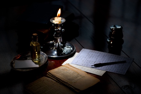 Letter writing by candlelight
