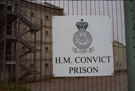 Fence and sign which reads 'H.M Convict Prison'