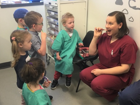 Student Izabela Wojslaw demonstrates how to brush properly