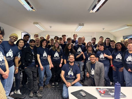 A large crowd of students and staff in matching navy t-shirts