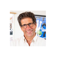 Photo of man wearing glasses smiling