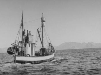 Black and white photo of small fishing boat