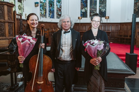 Three musicians standing in King's College Chapel