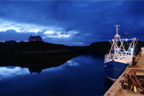 Night image of boat at quay