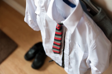 Image of school uniform. Shirt, tie and shoes