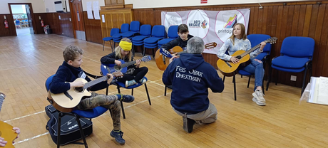 Children playing musical instruments.