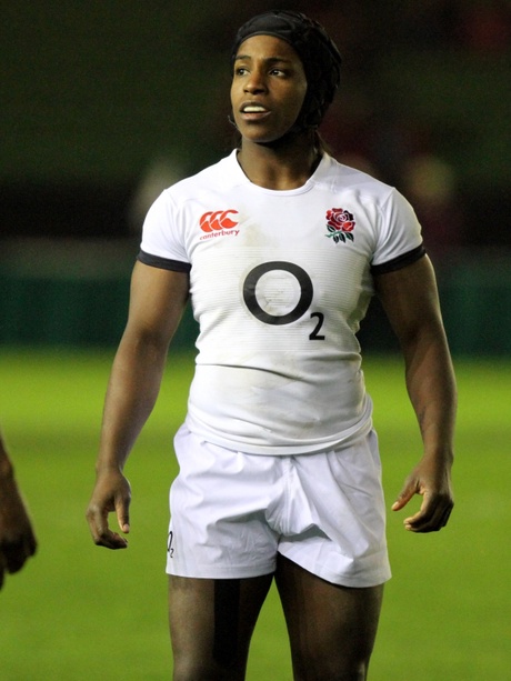 Maggie Alphonsi MBE standing on rugby pitch with England uniform on