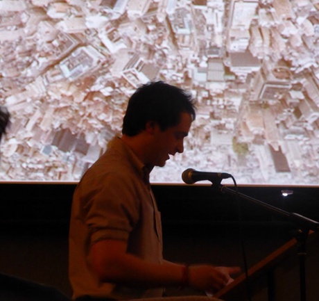 Person talking into a microphone