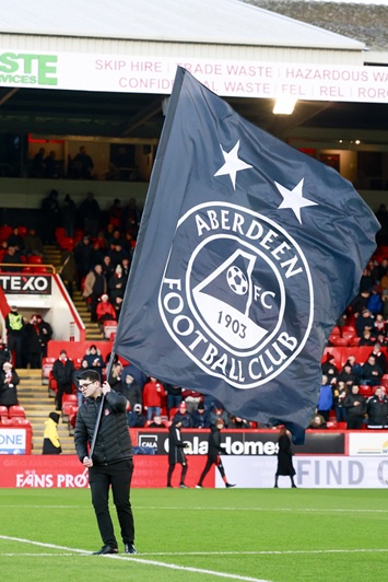 Adien Gordon flying an Aberdeen Football Club flag