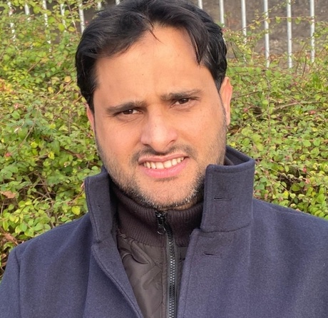 Picture of Bader standing outside.