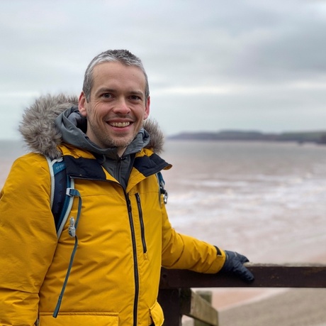 Martin standing on the beach.