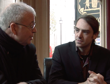 Thomas and Len discussing Charle's case in a London pub