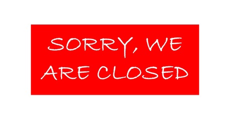 Image shows a sign with writing which says sorry we are closed