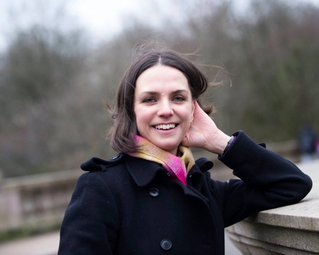 Dr Jane Stanley, standing in by a wall outside.