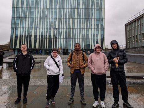The young people outside the Sir Duncan Rice Library