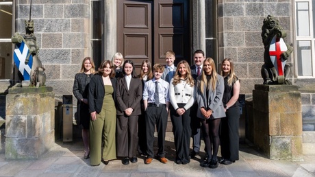 Students standing outside a building at the University of Aberdeen