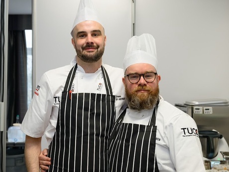 Two men side by side in chef's whites