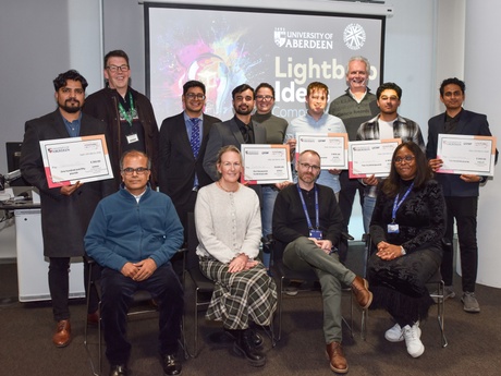 A group shot of the judges and participants
