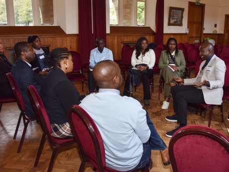 A group of attendees in a discussion group