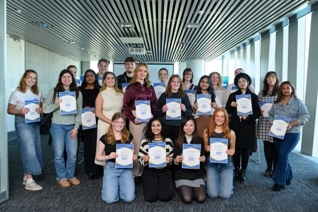 group of interns with their certificates