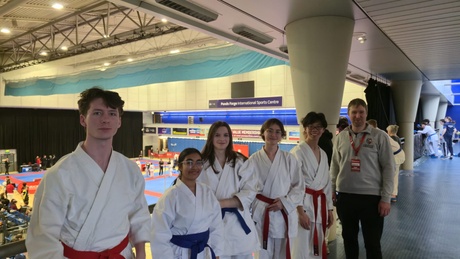 members of the karate club with their coach