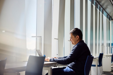 Person accessing research online in the Sir Duncan Rice Library