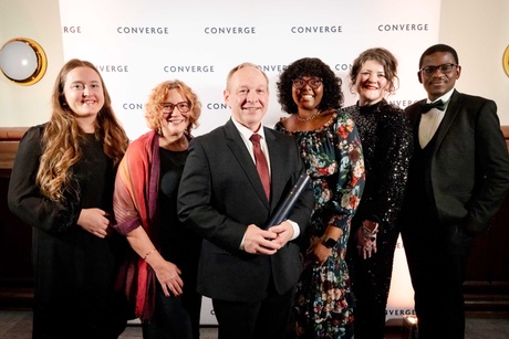 People posing with an award at the Converge Challenge awards