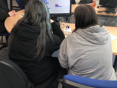 Two pupils working on a computer