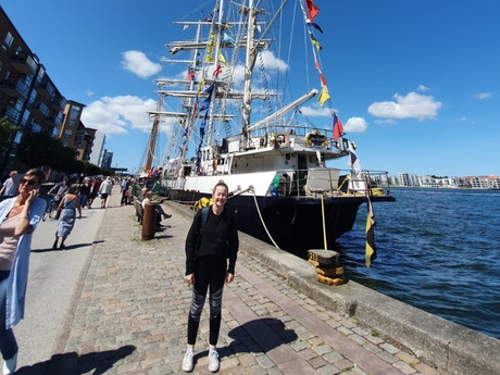 Morven standing quayside next to a tall ship