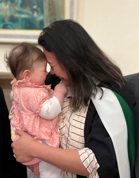 Tina holding her youngest child