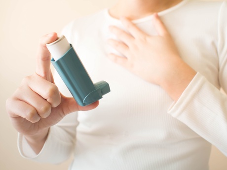 person with asthma inhaler