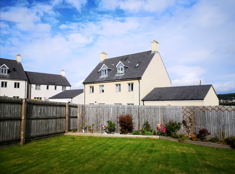 picture of a residential street with a garden