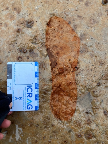Footprint marked with an outline left in the clay 2,000 years ago