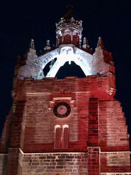 Kings chapel at night lit up orange