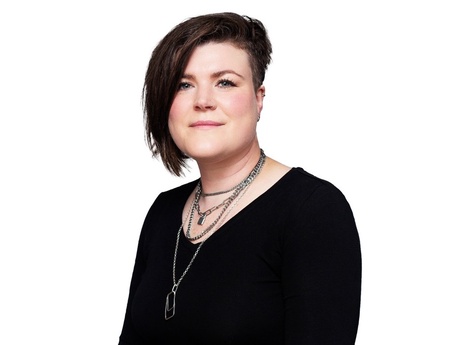 Head and shoulders image of Heather May in a black t-shirt